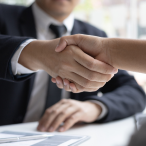 A handshake to represent closing a deal.