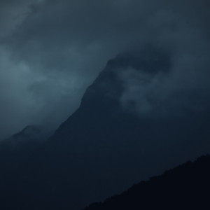 Dark cloud over a mountain.